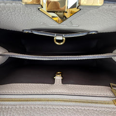 Capucines PM Microchipped